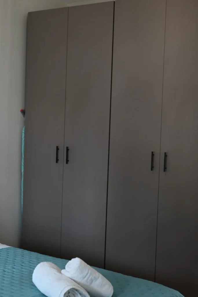 Emocean apartments master bedroom with towels wardrobe